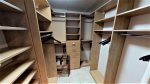 Master closet with plenty of shelf and hanging space